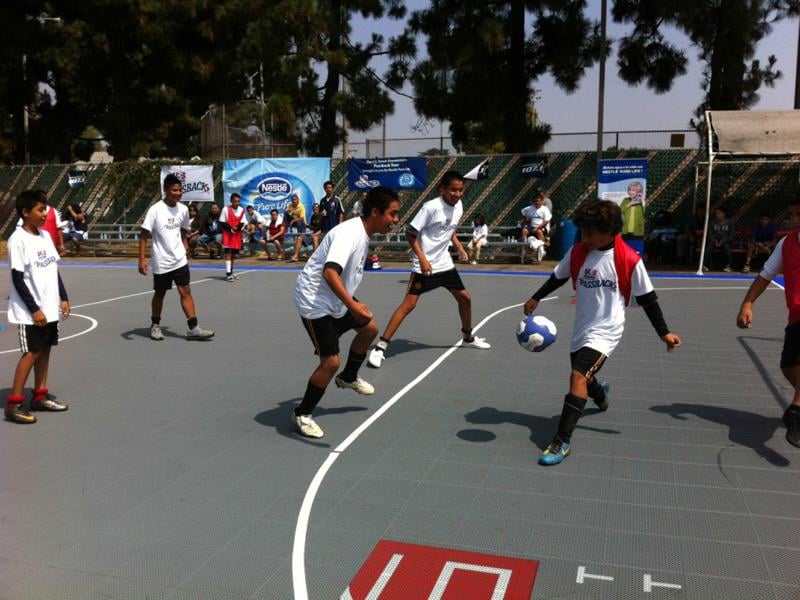 A group of boys playing Futsal