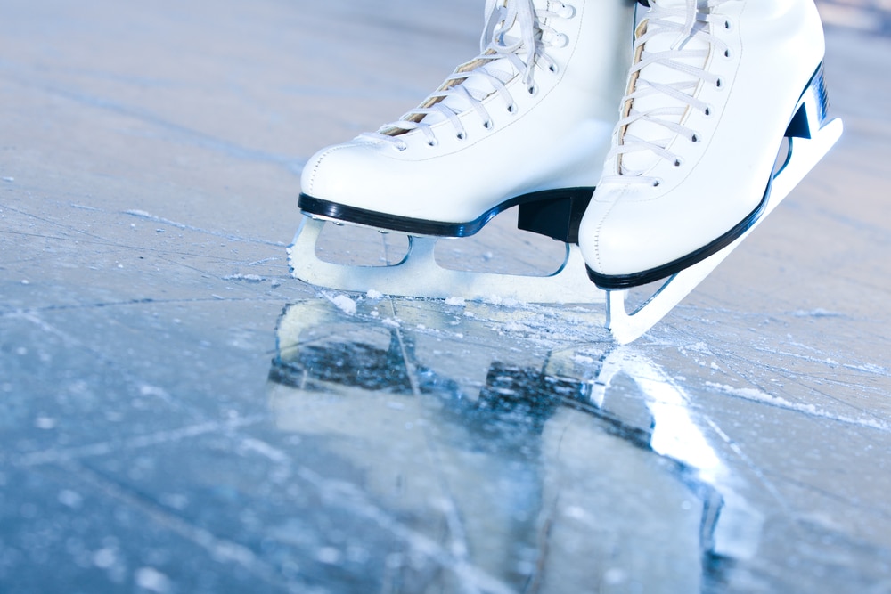 Ice skates on ice rink, close-up